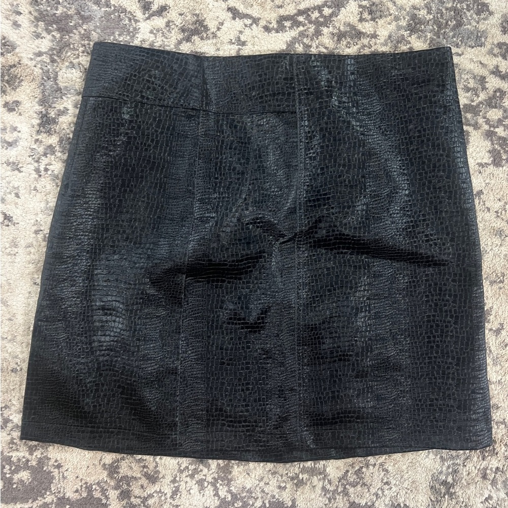 Faux leather miniskirt. Texture resembles alligator skin.